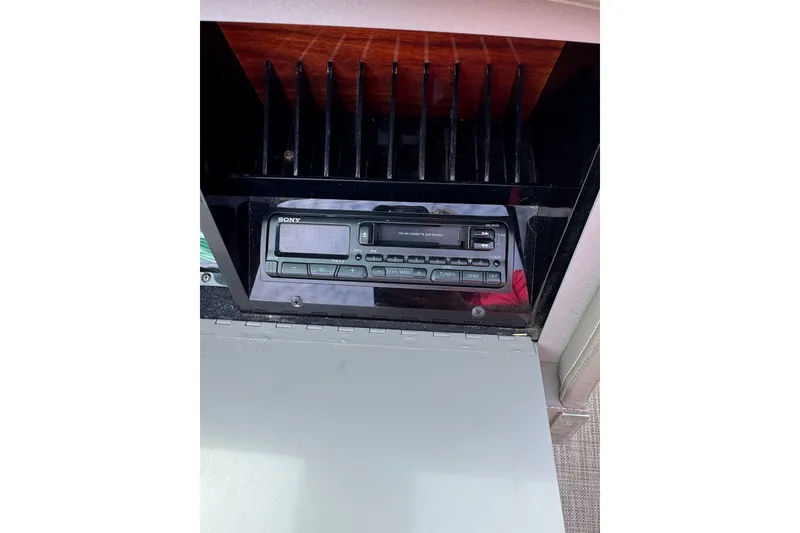Slide: The Image of 1996 Cobalt 272 boat stereo system with cassette player and tuner controls. - 27