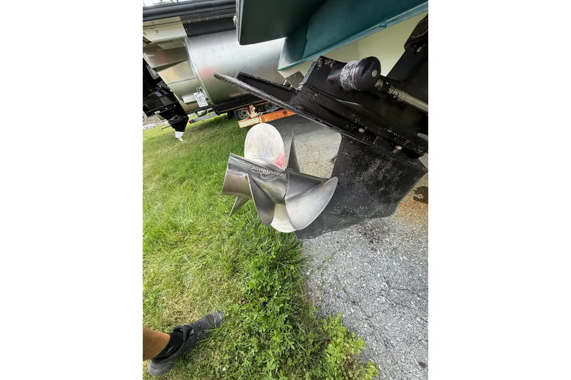 Slide: The Image of Propeller of a 1996 Cobalt 272 boat on grass, showcasing its metallic finish. - 39
