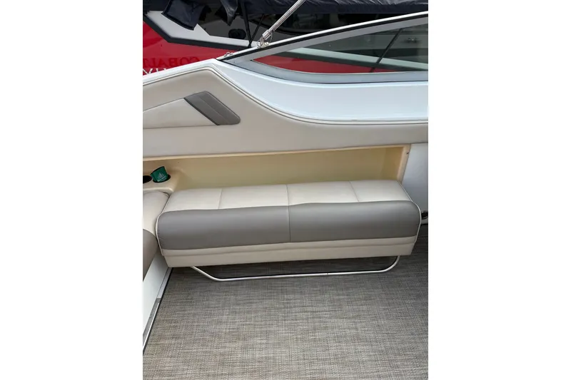 Slide: The Image of Interior seating of a 1996 Cobalt 272 boat, featuring beige and gray upholstery. - 49