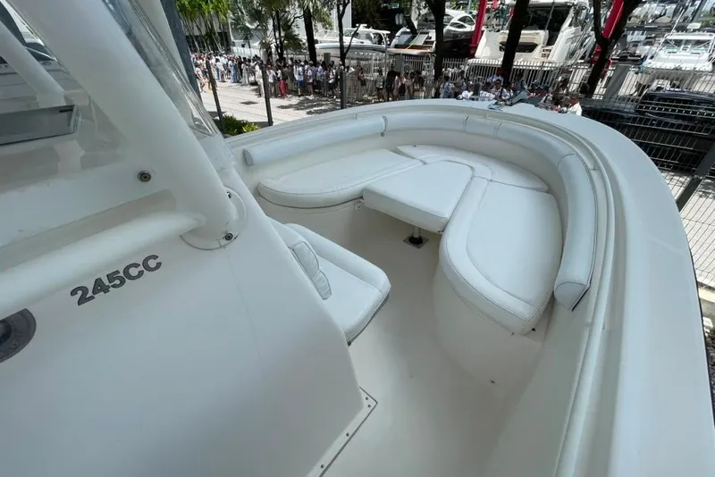 Slide: The Image of 2007 Edgewater 245CC boat interior with white seating and sleek design. - 16