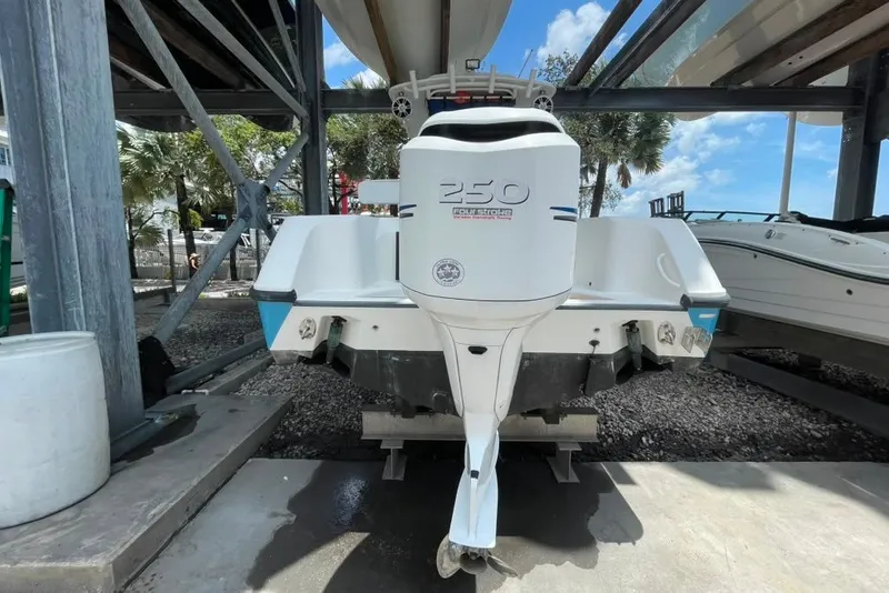 Slide: The Image of 2007 Edgewater 245CC boat with a 250 horsepower outboard motor in a storage facility. - 27