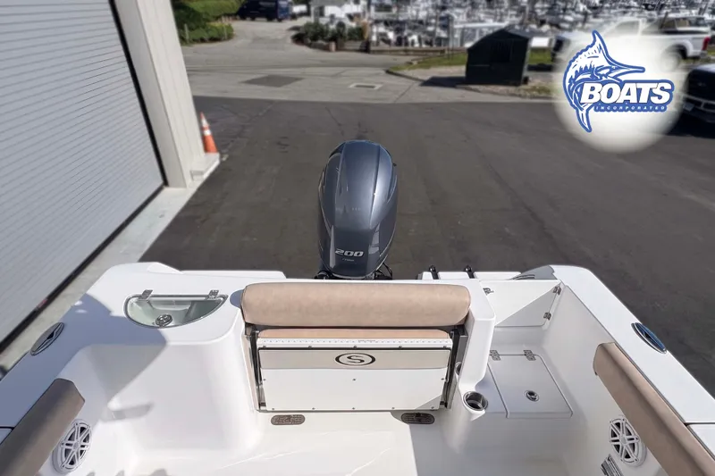 Slide: The Image of 2019 Sportsman Open 232 Center Console boat with outboard motor at marina. - 10