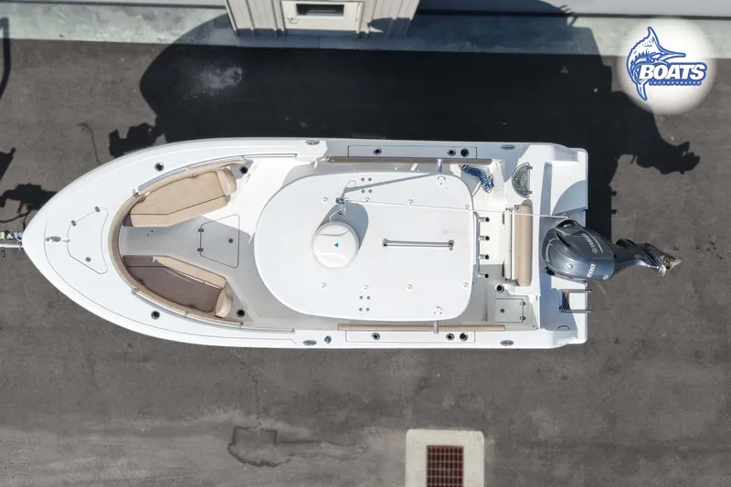 Slide: The Image of Overhead view of 2019 Sportsman Open 232 Center Console boat on pavement. - 3