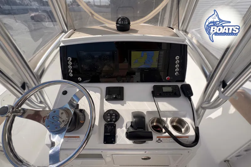 Slide: The Image of 2019 Sportsman Open 232 Center Console helm with navigation and control systems. - 4