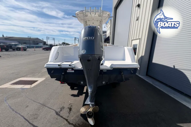 Slide: The Image of 2019 Sportsman Open 232 Center Console boat with powerful outboard motor. - 11