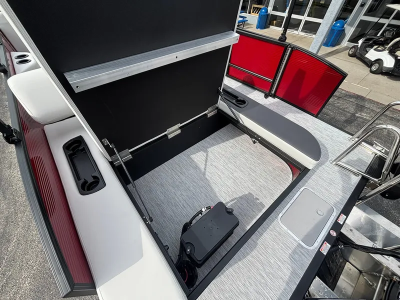 Slide: The Image of The image shows the interior of a Bennington 21 S1SB SPS boat with seating and storage space. - 27