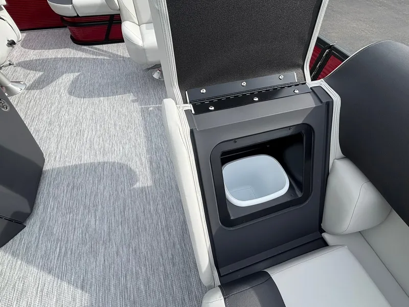 Slide: The Image of The image shows the interior of a Bennington 21 S1SB SPS boat with a built-in trash bin. - 16
