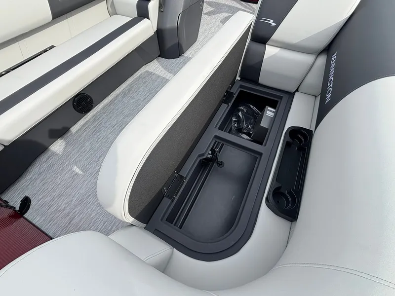 Slide: The Image of The image shows the interior of a 2027 Bennington 21 S1SB SPS with an open storage compartment. - 15