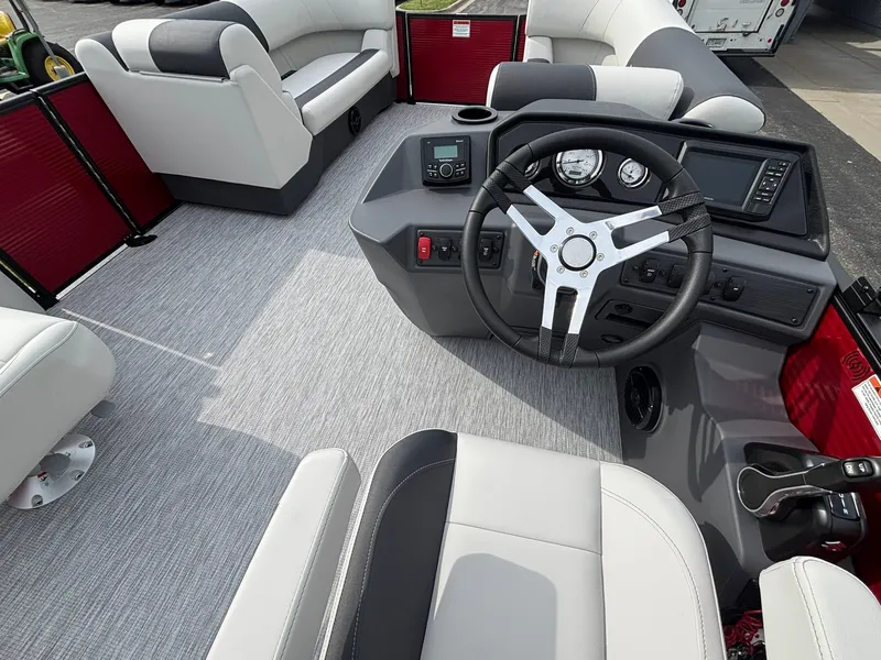 Slide: The Image of The image shows the cockpit of a 2027 Bennington 21 S1SB SPS boat with modern instruments and comfortable seating. - 20