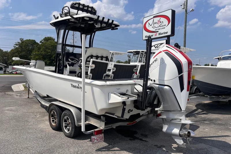 Slide: The Image of 2022 Tidewater 2500 Carolina Bay boat on trailer at dealership, rear view. - 2