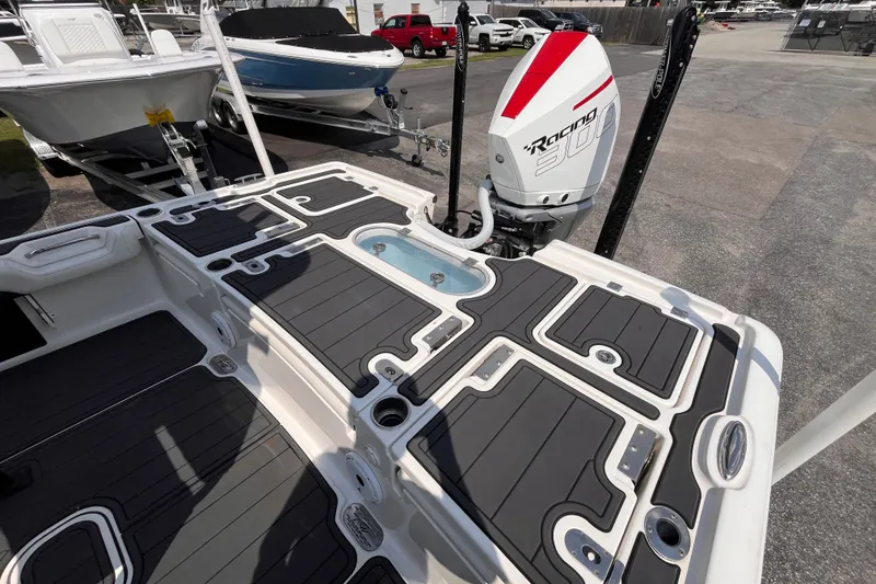 Slide: The Image of 2022 Tidewater 2500 Carolina Bay boat with sleek deck design and powerful outboard motor. - 16