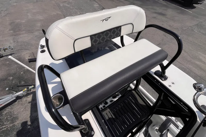 Slide: The Image of 2022 Tidewater 2500 Carolina Bay boat seat with black and white upholstery. - 20