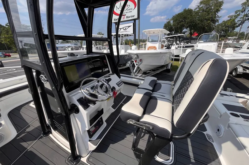 Slide: The Image of 2022 Tidewater 2500 Carolina Bay boat interior with modern helm and seating. - 15