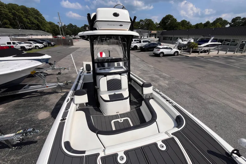 Slide: The Image of 2022 Tidewater 2500 Carolina Bay boat in a dealership lot, showcasing sleek design and modern features. - 13