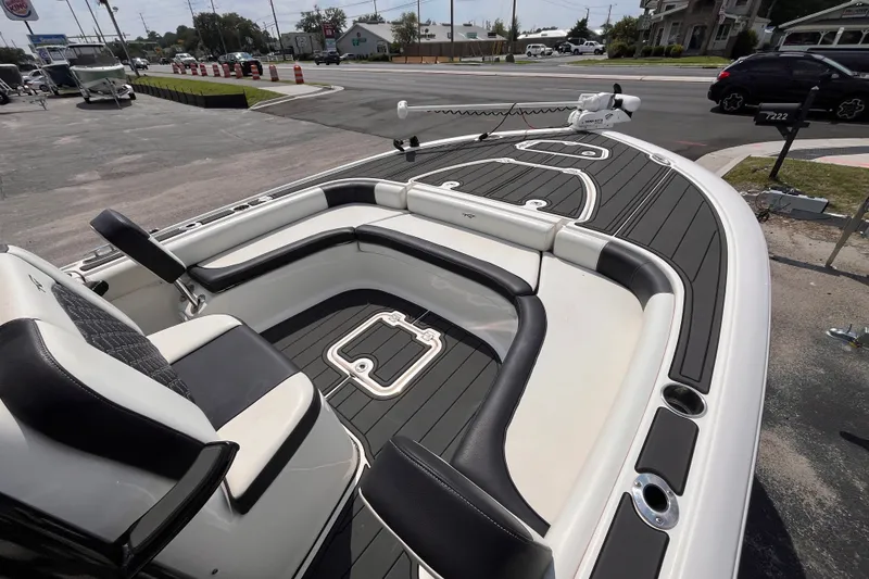 Slide: The Image of 2022 Tidewater 2500 Carolina Bay boat with sleek seating and modern deck design. - 11