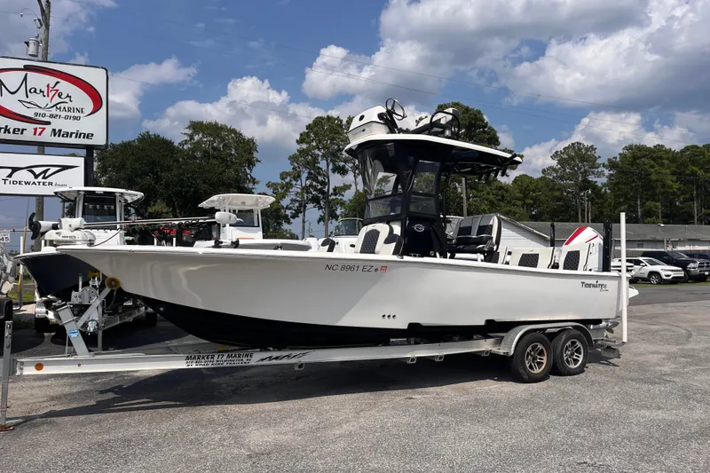 Slide: The Image of 2022 Tidewater 2500 Carolina Bay boat on trailer at Marker 17 Marine dealership. - 1