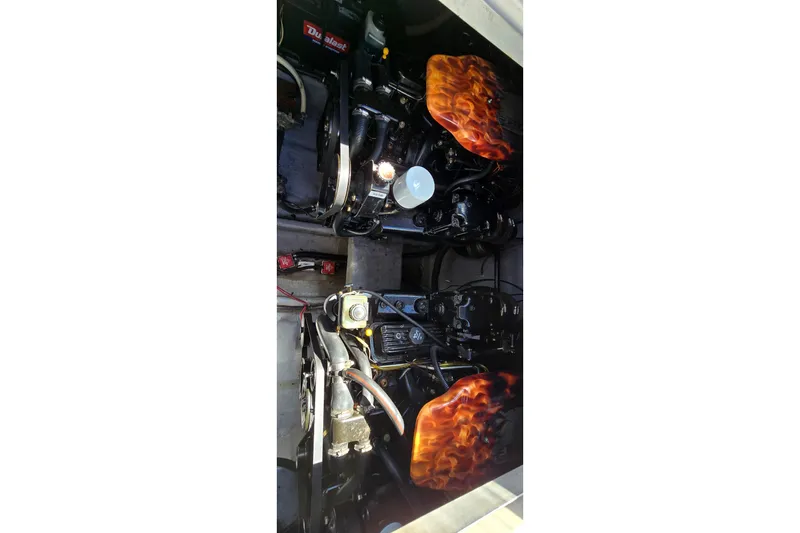 Slide: The Image of Engine compartment of a 2001 Monterey 322 Cruiser with custom flame-painted covers. - 34