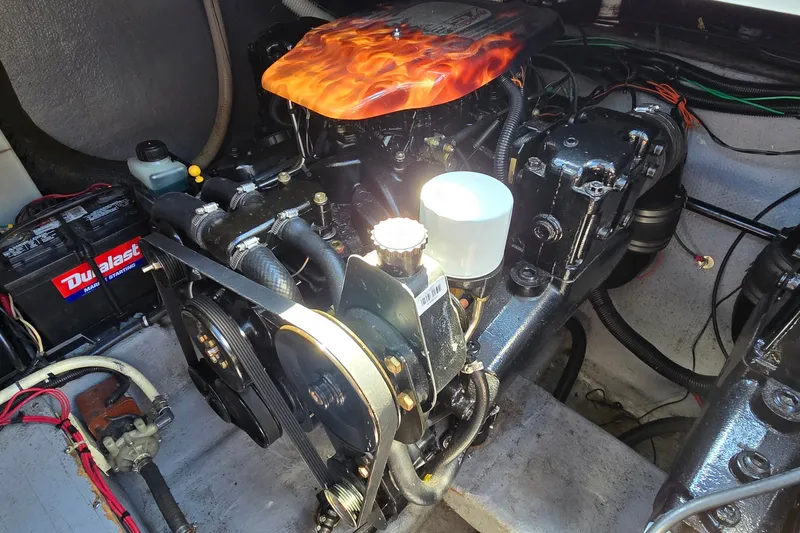 Slide: The Image of Engine compartment of a 2001 Monterey 322 Cruiser with visible battery and components. - 31