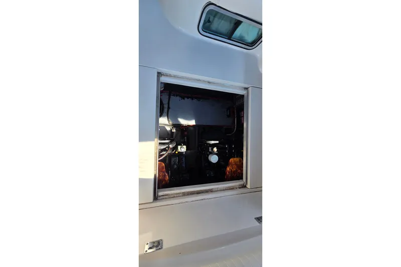 Slide: The Image of Engine compartment of a 2001 Monterey 322 Cruiser boat, showcasing internal components. - 35