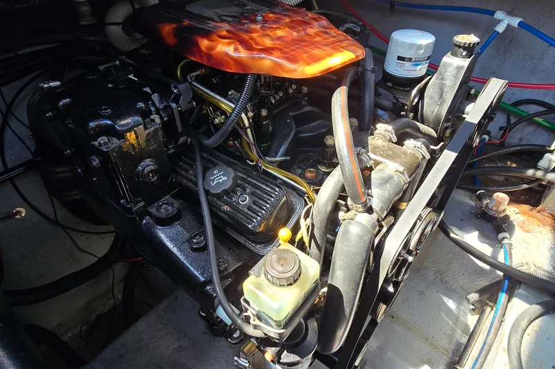 Slide: The Image of Engine compartment of a 2001 Monterey 322 Cruiser with custom flame-painted cover. - 30