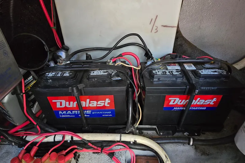Slide: The Image of Duralast marine batteries in a 2001 Monterey 322 Cruiser engine compartment. - 32