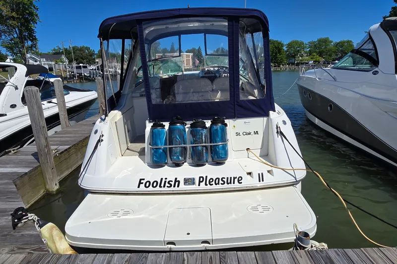 Slide: The Image of 2001 Monterey 322 Cruiser docked, named "Foolish Pleasure," in St. Clair, MI marina. - 3