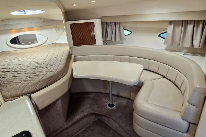Slide: The Image of Interior of a 2001 Monterey 322 Cruiser with cozy seating and elegant design. - 18