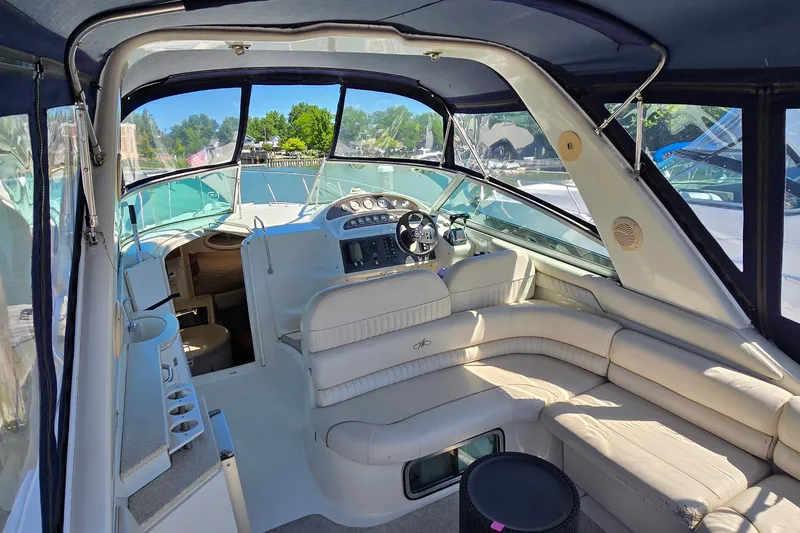 Slide: The Image of Interior view of a 2001 Monterey 322 Cruiser boat with seating and helm. - 6