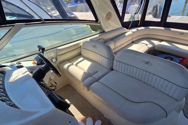 Slide: The Image of Interior of a 2001 Monterey 322 Cruiser with plush seating and steering console. - 10