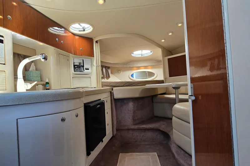 Slide: The Image of Interior of 2001 Monterey 322 Cruiser with kitchenette and seating area. - 25