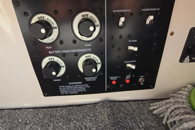 Slide: The Image of Control panel of a 2001 Monterey 322 Cruiser with battery disconnect switches and power controls. - 36