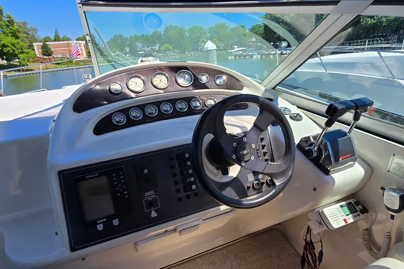 Slide: The Image of Helm of 2001 Monterey 322 Cruiser with steering wheel and control panel. - 11