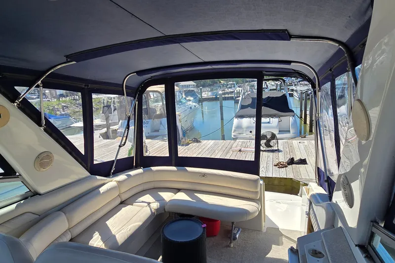 Slide: The Image of Interior view of a 2001 Monterey 322 Cruiser yacht docked at a marina. - 16