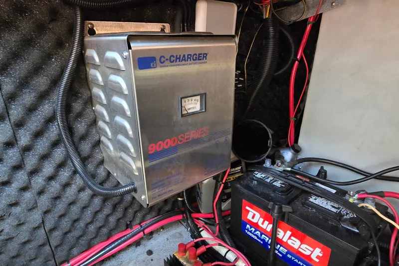 Slide: The Image of Battery charger and marine battery setup in a 2001 Monterey 322 Cruiser boat. - 33