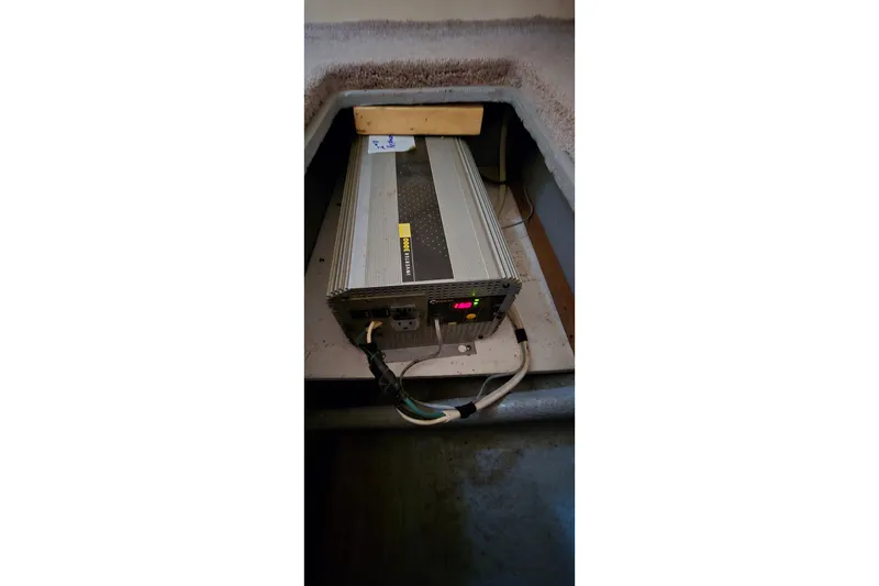 Slide: The Image of Power inverter installed in a 2001 Monterey 322 Cruiser boat compartment. - 29