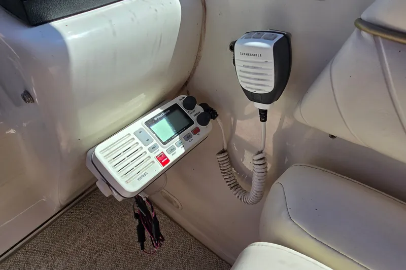 Slide: The Image of VHF marine radio and microphone in a 2001 Monterey 322 Cruiser boat interior. - 12