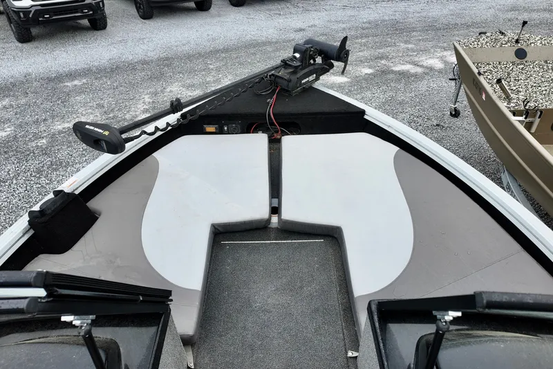 Slide: The Image of 2023 Starcraft Delta 188 DC Pro boat interior with seating and trolling motor. - 7