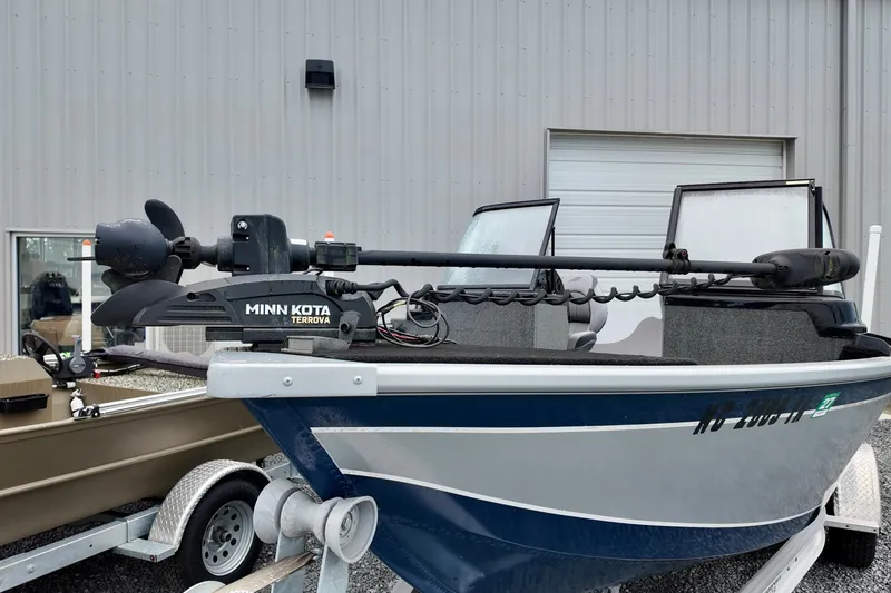 Slide: The Image of 2023 Starcraft Delta 188 DC Pro boat with Minn Kota Terrova motor, parked on a trailer. - 10