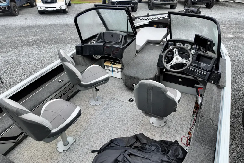 Slide: The Image of 2023 Starcraft Delta 188 DC Pro boat interior with seating and control panel. - 3
