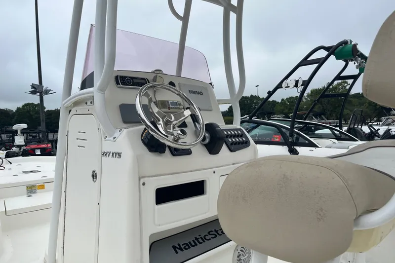 Slide: The Image of 2017 Nautistar 227 XTS boat console with steering wheel and controls. - 4