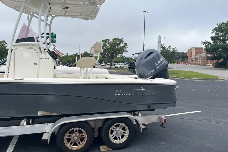 Slide: The Image of 2017 Nautistar 227 XTS boat on trailer with Yamaha outboard motor in parking lot. - 5