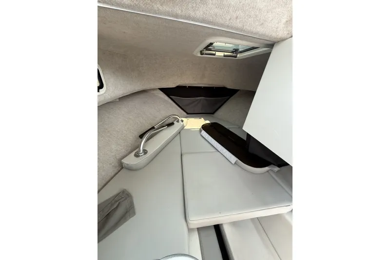 Slide: The Image of Interior cabin of 2021 Parker 2120 Sport Cabin boat, featuring seating and hatch. - 5