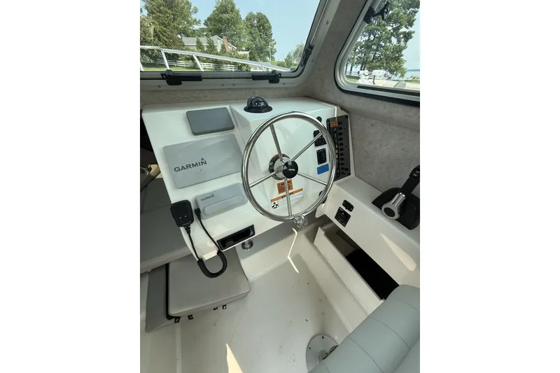 Slide: The Image of Interior of 2021 Parker 2120 Sport Cabin boat with Garmin navigation system. - 6