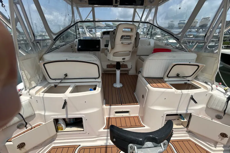 Slide: The Image of 2005 Grady-White Express 330 boat interior with seating and storage compartments. - 6
