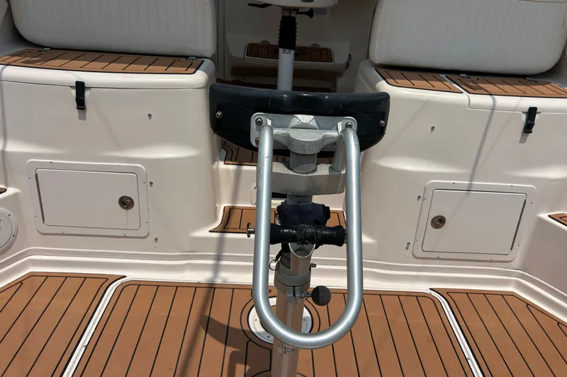 Slide: The Image of 2005 Grady-White Express 330 boat interior with teak flooring and seating. - 5