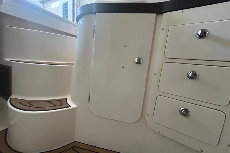Slide: The Image of Interior view of 2005 Grady-White Express 330 boat with storage compartments and steps. - 23