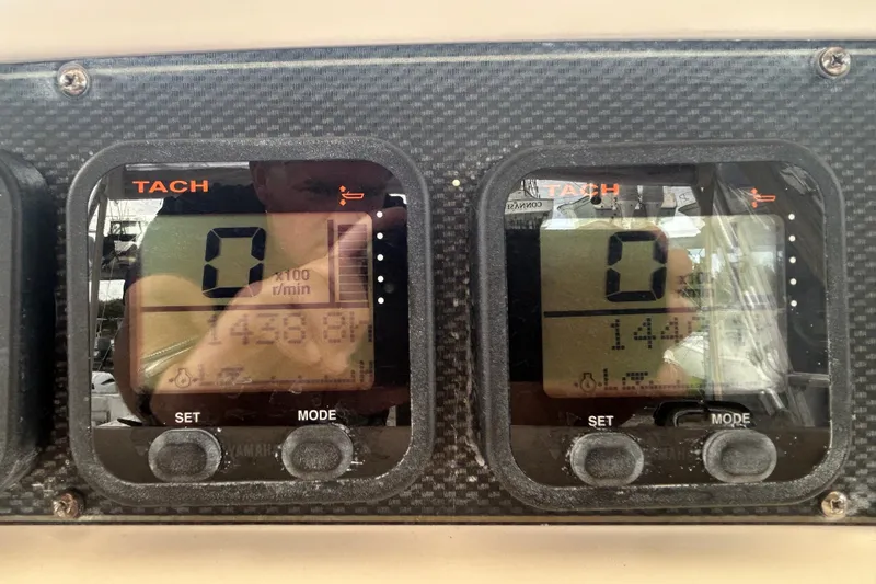 Slide: The Image of Digital tachometer display on 2005 Grady-White Express 330 boat dashboard. - 33