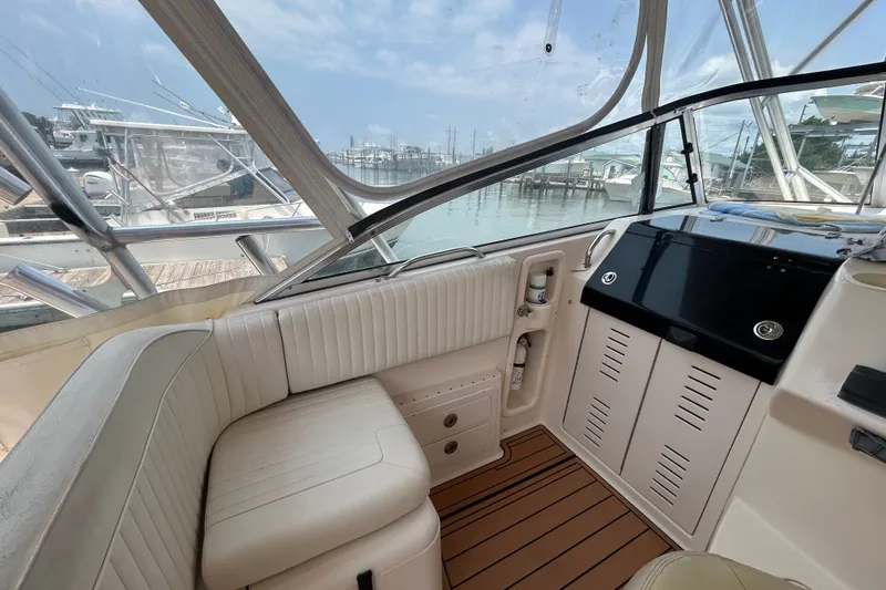 Slide: The Image of 2005 Grady-White Express 330 boat interior with seating and control panel. - 10