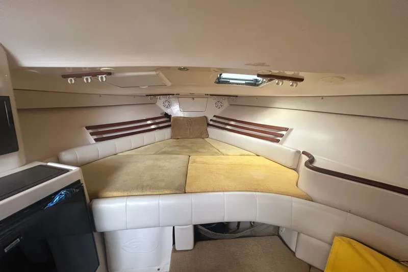 Slide: The Image of Interior cabin of 2005 Grady-White Express 330 boat, featuring cozy sleeping area. - 14