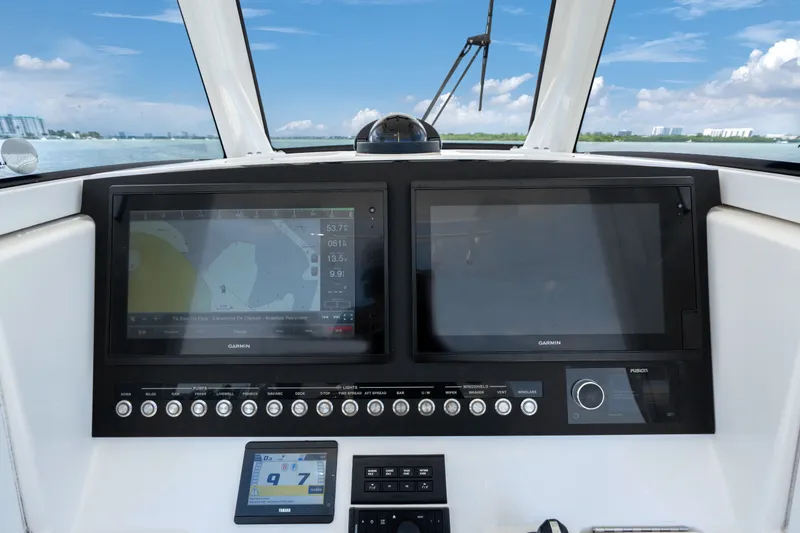Slide: The Image of Dashboard of 2023 Regulator 28 Forward Seating boat with Garmin navigation displays. - 20